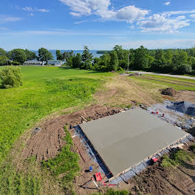 Freshly poured concrete slab overlooking Lake Champlain